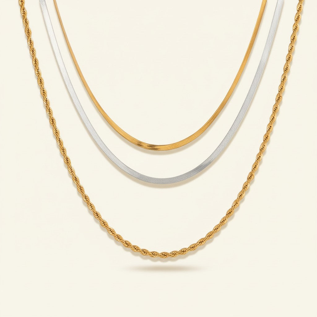 Seraphina Treasures Zephoria layered necklace with gold rope and herringbone chains and a silver herringbone chain.