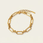 Seraphina Treasures Zephyra gold-tone stainless steel geometric link bracelet with adjustable clasp.