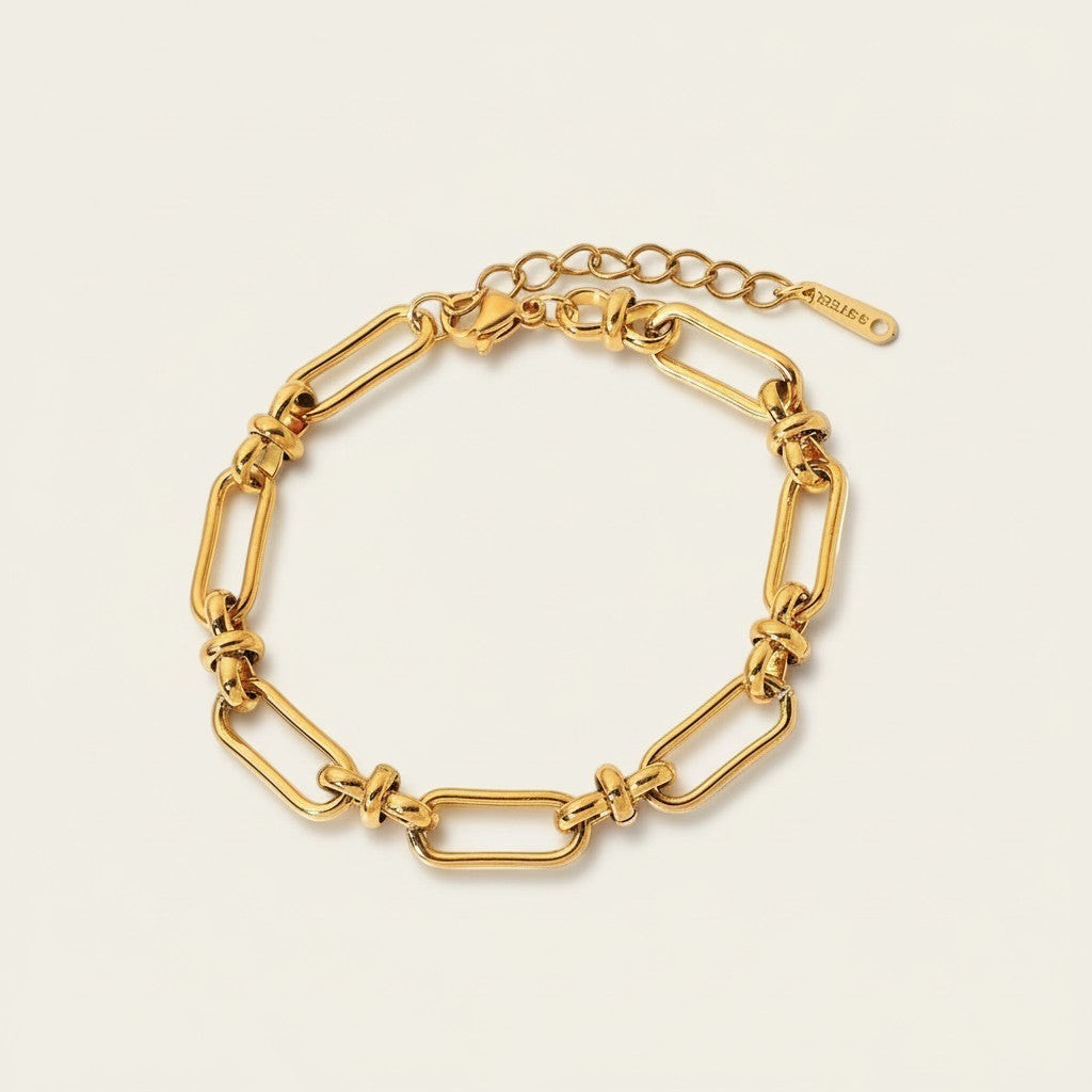 Seraphina Treasures Zephyra gold-tone stainless steel geometric link bracelet with adjustable clasp.