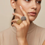 Seraphina Treasures Zerath gold and silver hollow beaded dome rings on a hand, perfect for stacking.