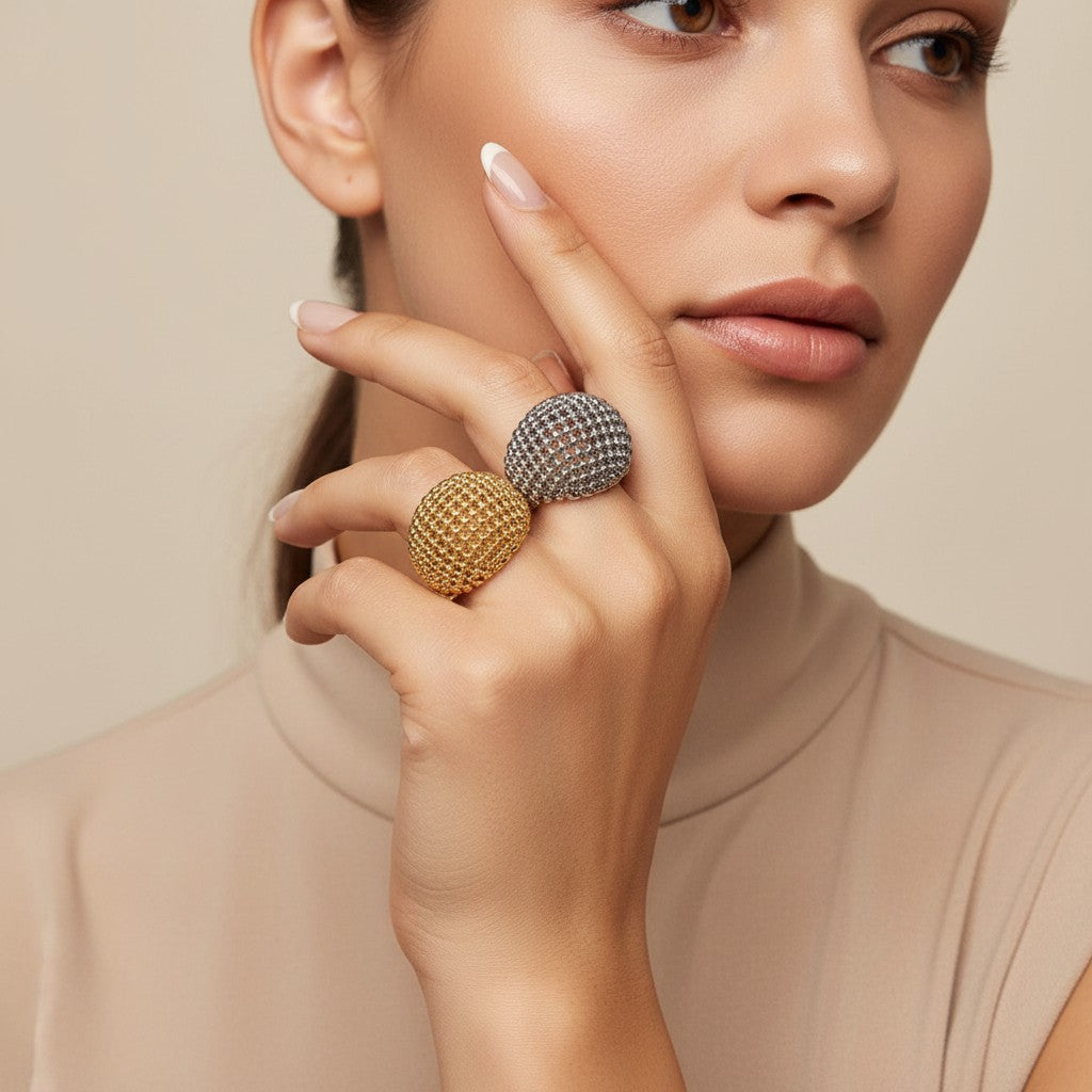 Seraphina Treasures Zerath gold and silver hollow beaded dome rings on a hand, perfect for stacking.