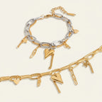 Seraphina Treasures Zorya two-layer bracelet with gold heart and star charms. Silver and gold tones.